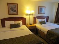 a hotel room with two beds and a telephone at Bryce View Lodge Part of the Ruby's Inn Resort in Bryce Canyon
