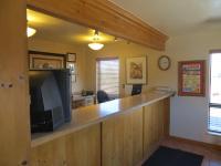 an office with a bar with a television and a desk at Bryce View Lodge Part of the Ruby's Inn Resort in Bryce Canyon