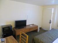 a room with a desk with a television and a bed at Bryce View Lodge Part of the Ruby's Inn Resort in Bryce Canyon
