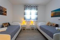 Posteľ alebo postele v izbe v ubytovaní Apartments Jasa Deluxe