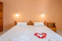 Posteľ alebo postele v izbe v ubytovaní Achillion Apartments & Studios