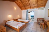 Posteľ alebo postele v izbe v ubytovaní Achillion Apartments & Studios