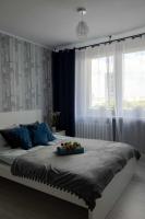 Posteľ alebo postele v izbe v ubytovaní Apartament Wika