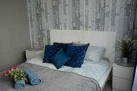 Posteľ alebo postele v izbe v ubytovaní Apartament Wika