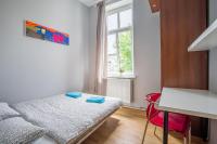 Postel nebo postele na pokoji v ubytování Duże mieszkanie - Aleja Niepodległości