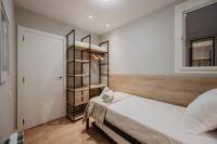 Posteľ alebo postele v izbe v ubytovaní Petit Luxe Volta Apartaments