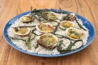 a blue plate of food with oysters and rice at Hôtel De La Vallée in Dinard