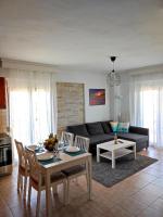 A seating area at Sea Breeze Apartment