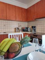 A kitchen or kitchenette at Sea Breeze Apartment