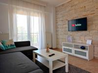 A television and/or entertainment centre at Sea Breeze Apartment