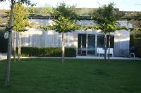 a group of trees in front of a house at Gardenhouse &#39;The Block&#39; - Ostend - private garden - IR cabine - AC in Ostend