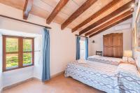 A bed or beds in a room at Can Faveta