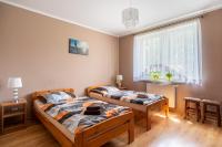 Posteľ alebo postele v izbe v ubytovaní Apartament Grażyna