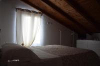 Łóżko lub łóżka w pokoju w obiekcie Gli zii di Sicilia - casa vacanze