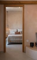 Postel nebo postele na pokoji v ubytování Opuntia Suites