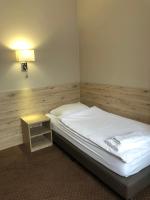 Postel nebo postele na pokoji v ubytování Hotel Krystyna