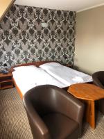 Postel nebo postele na pokoji v ubytování Hotel Krystyna