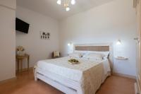 A bed or beds in a room at Arbor Exclusive B&B