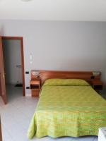 A bed or beds in a room at Bed and Breakfast "POGGIO MARANO"