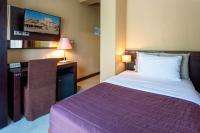 Hotel Petit Palaisにあるベッド