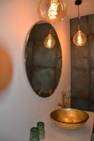 a bathroom with a sink and a mirror at Huize Maurits in The Hague