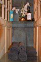a bunch of towels sitting on a counter in a bathroom at Huize Maurits in The Hague