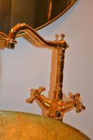 a brass lamp on top of a table at Huize Maurits in The Hague