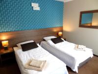 Postel nebo postele na pokoji v ubytování Hotel Krystyna