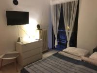 Łóżko lub łóżka w pokoju w obiekcie Marina Apartment