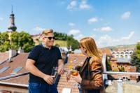 a man and a woman standing on top of a building at Das Mühlentor Hotel in Bad Kreuznach