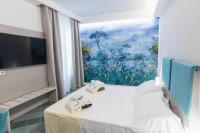 Posteľ alebo postele v izbe v ubytovaní Hotel L'Approdo