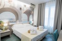 Posteľ alebo postele v izbe v ubytovaní Hotel L'Approdo