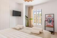 Posteľ alebo postele v izbe v ubytovaní Ikos residence