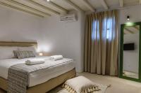 Posteľ alebo postele v izbe v ubytovaní Ikos residence