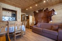 a living room with a couch and a table at Résidence Le Sérac - Val Thorens in Val Thorens