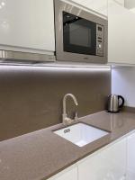 Kuchyň nebo kuchyňský kout v ubytování St Stephen Luxury Apartment