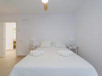 A bed or beds in a room at Pasitoblanco Porto Mare 7 Seaview Villa private heated pool