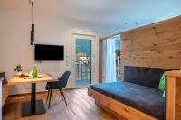 A television and/or entertainment centre at Luisl Hof - Apartment Pomum