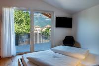 A bed or beds in a room at Luisl Hof - Apartment Pomum