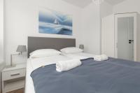 Posteľ alebo postele v izbe v ubytovaní Lake House Sosnowy Las Mielno by Noclegi Renters