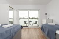 Posteľ alebo postele v izbe v ubytovaní Lake House Sosnowy Las Mielno by Noclegi Renters