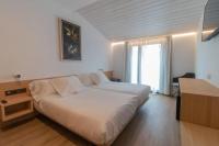 Posteľ alebo postele v izbe v ubytovaní Hotel Cortabitarte