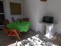 Televízia a/alebo spoločenská miestnosť v ubytovaní Apartments Azoa