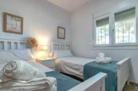 Posteľ alebo postele v izbe v ubytovaní Independent Villa BEACH HOUSE EL BOSQUE
