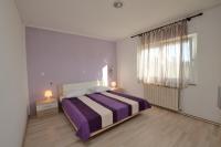 Łóżko lub łóżka w pokoju w obiekcie Villa Mirka