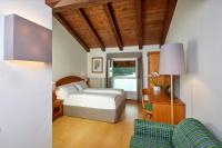 Posteľ alebo postele v izbe v ubytovaní Grand Hotel Misurina