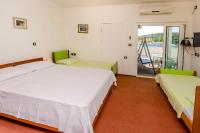 Postel nebo postele na pokoji v ubytování Apartments Jerkunica