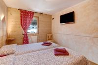 A bed or beds in a room at Baita dei ski app 2