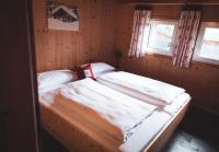 Posteľ alebo postele v izbe v ubytovaní Hüttendorf Hohentauern - Dein Feriendomizil in den Bergen