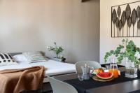 a bedroom with a bed and a table with fruit on it at Florentia Art Apartments in Florence